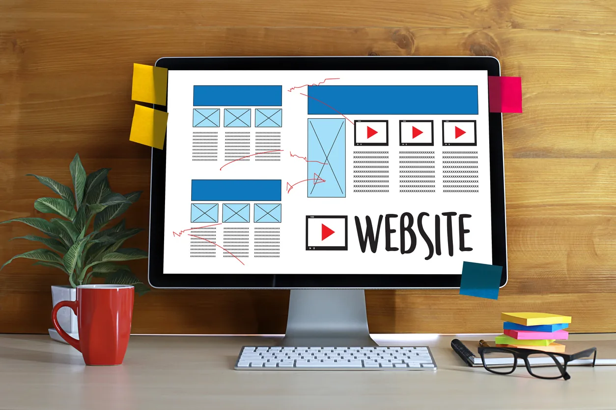Website layout mockup on a desktop monitor